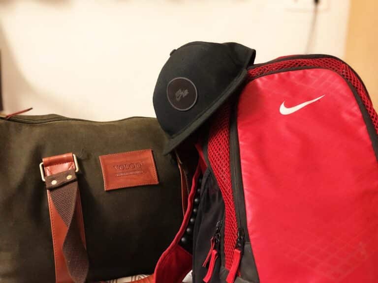 black cap on duffle bags